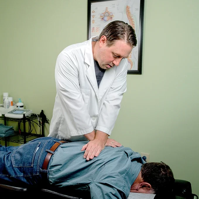 Chiropractor Raleigh NC Jeffrey Gerdes Adjusting Patient